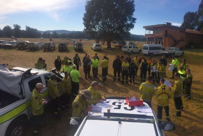 Remote Area Fire Teams being briefed at the Old Bega Racecourse which has doubled as a heliport over the last 44 days. RAFT crews have come from across NSW and the ACT. Photo: Garry Cooper RFS.