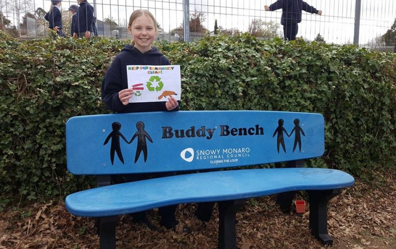 Alex Reed and the 'Buddy Bench' she won for St Joseph's Primary School. Photo: Supplied.
