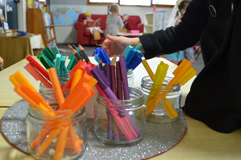coloured pens in jars