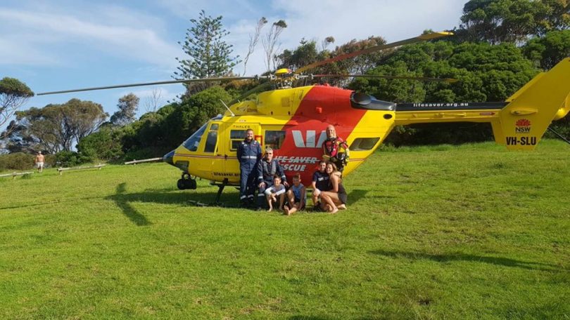 A happy ending. Two boys, and two girls from Victoria, aged between 10 and 16 years, were rescued by the Westpac Rescue Helicopter Service near Bermagui's Blue Pool. Photo: Westpac Rescue Helicopter Service.