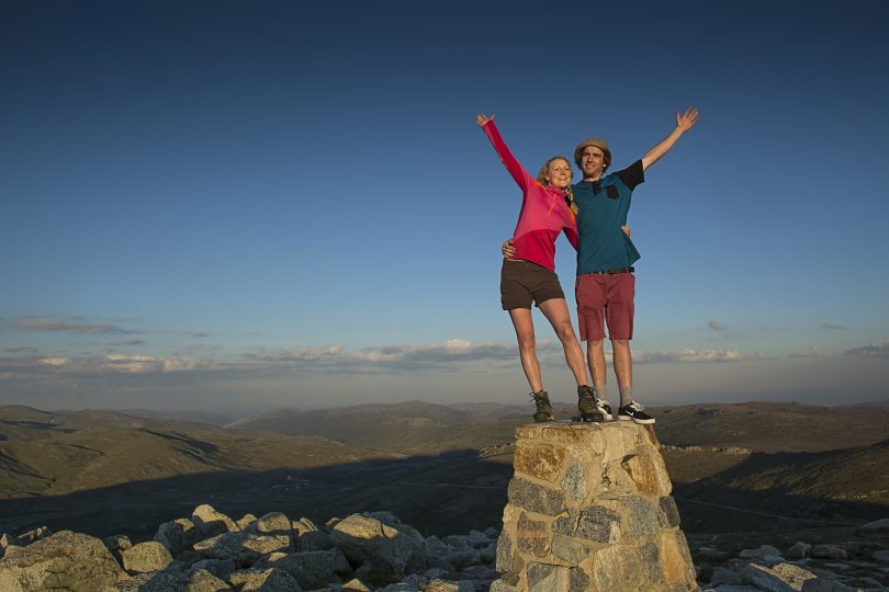 Man and woman at Mount Kosciusko peak