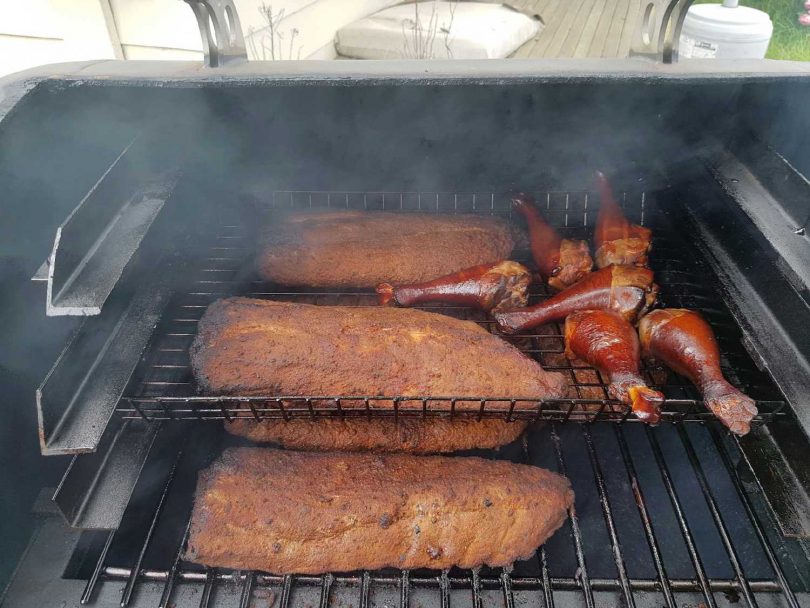 Ribs and Turkey legs in the smoker at Brogo Fire Shed Christmas Party. Photo: Supplied.