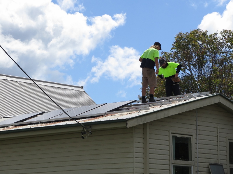 Roof top solar being installed on the Red Door Cafe, Anglican Parish Moruya. Photo: SHASA.