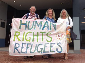 Bega Valley refugee signs to stay – “We won’t bow down to vandals”