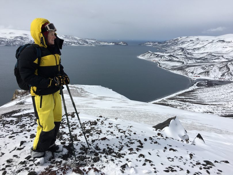 Dr Ceridwen Fraser, pictured on a trip sampling soils and mosses on volcanic Deception Island in Antarctica. Photo: Supplied.
