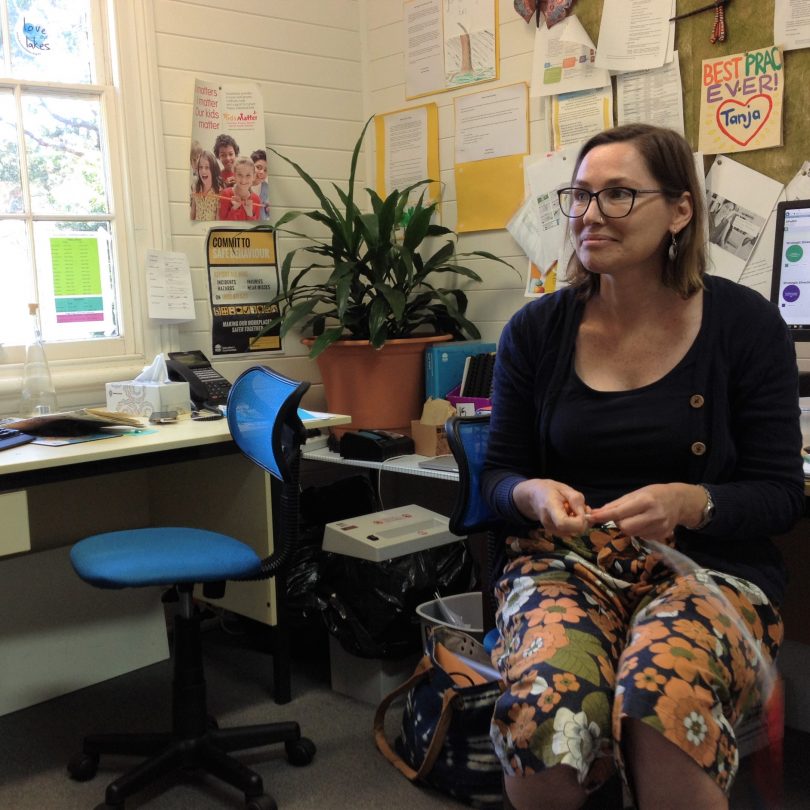 Acting principal for 2019, Danielle McGrath, threads beads in preparation for a kindergarten maths class. Photo: Elka Wood.