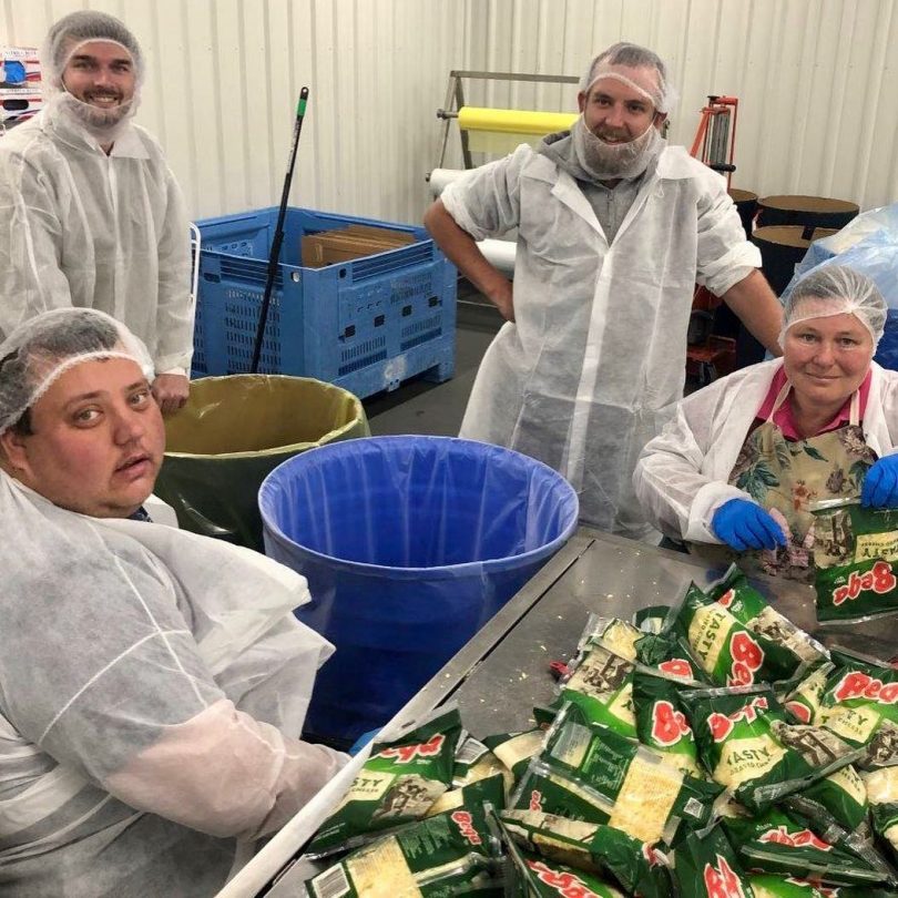 Workers from Tulgeen Disability Services at the Bega Cheese packaging facility. Photo: Supplied.