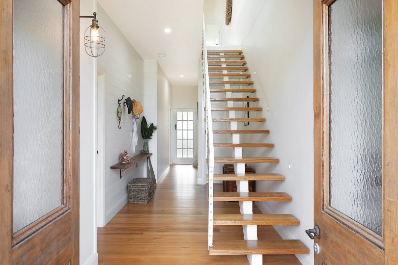 Beautiful hand-crafted stairs create an impressive entry. Photo: Supplied