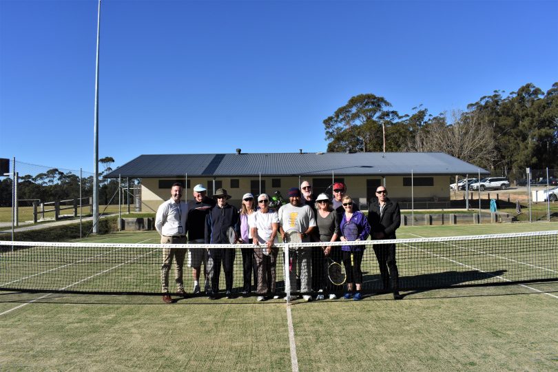 Bodalla residents can enjoy a hit of tennis on newly-refurbished courts.Pictured is Eurobodalla Council representatives and members of the Bodalla Tennis Club. Photo: Supplied.