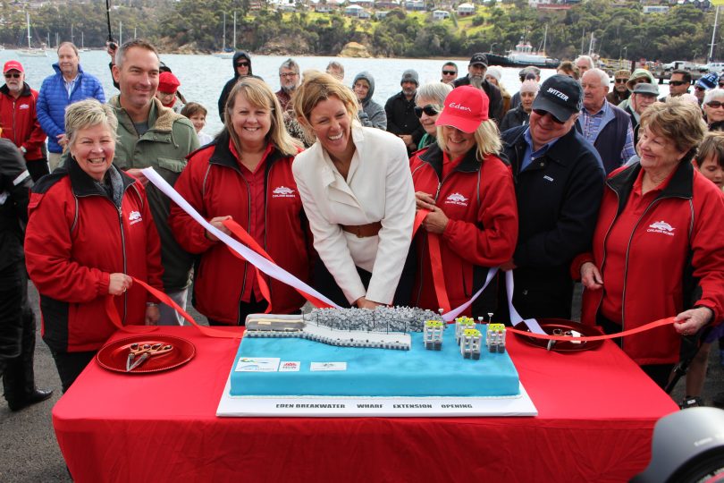 Natalie Godward (Centre) Cruise Development Manager Port Authority of NSW, cuts the cake. Photo: Ian Campbell.