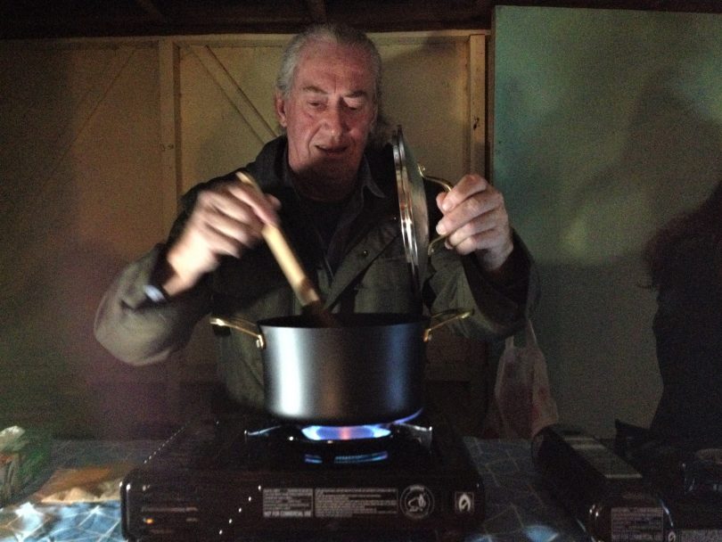 Greg Gillen warms tomato soup in Bega on Thursday 1st August. Photo: Elka Wood. 