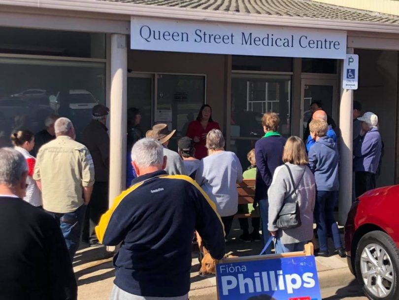 Fiona Phillips speaks with concerned locals outside Queen Street Medical Centre at Tuross Head.