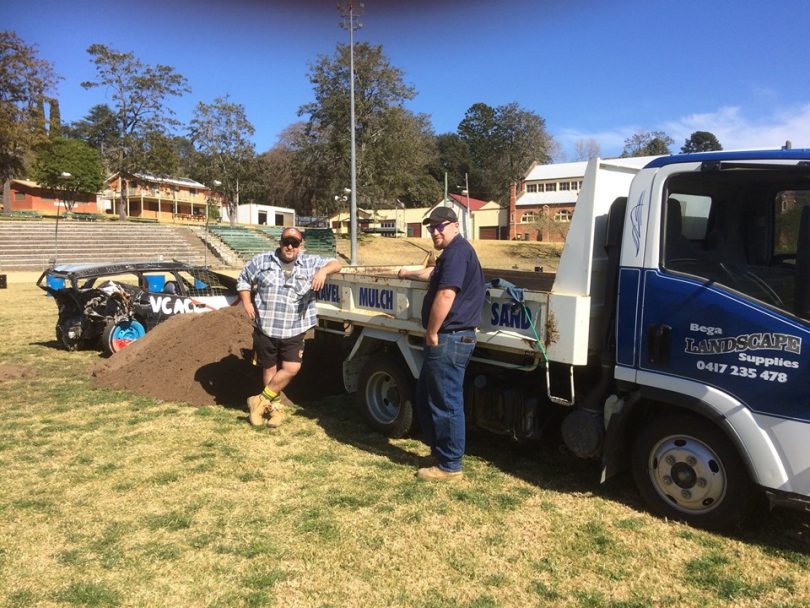 Jason Whiby and ""one of the good looking rosters" from Bega Landscape Supplies helping prepare the showground surface during the week. Photo: Supplied.
