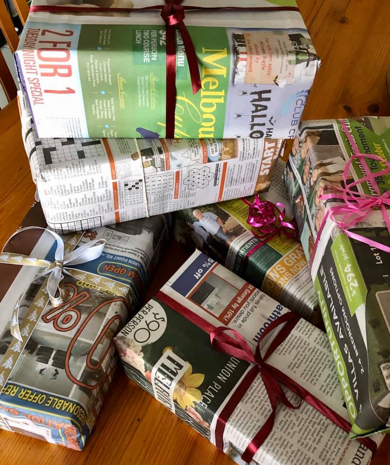 Wrapping parcels in newspaper cuts down on waste but also lets the recipient know where the parcel originated. Photo: Ladies of the Land Facebook. 