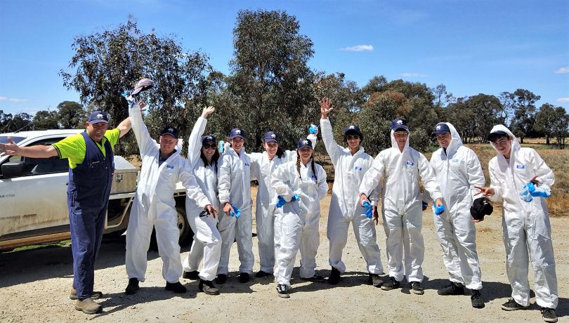 Moruya High School students suited up during a farm tour on their HSC field trip. Photo: Supplied. 