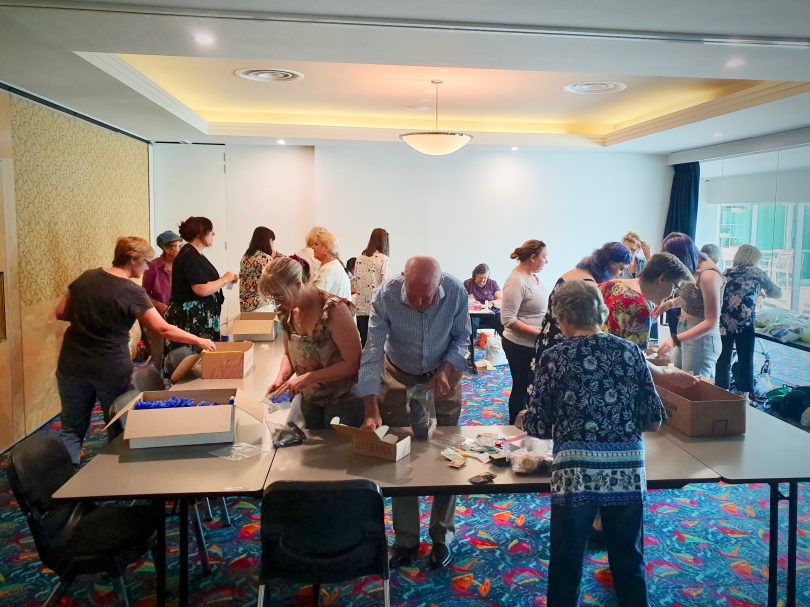 Volunteers pack Emergency Disaster Relief Care Kits at the Batemans Bay Soldiers Club. Photo: Supplied.