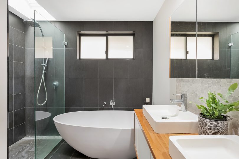 From the egg-shaped bath her friends covet to the openable shower skylight, the main house bathroom is designed with relaxation in mind. Photo: Supplied. 