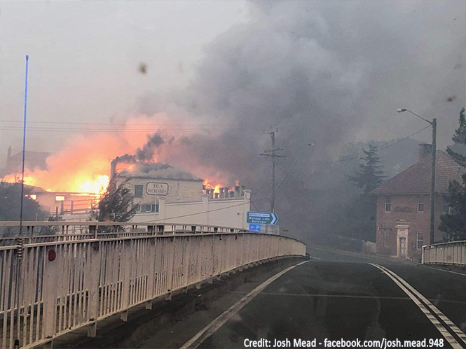 Buildings burning during bushfire in Cobargo.