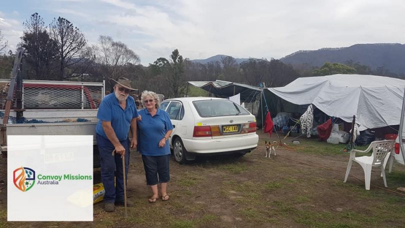 Jim and Enid at their Verona property, where they are living in a tent after bushfire burnt their house. Photo: Andrew Trieu. 