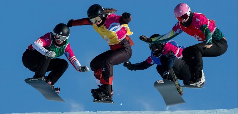 Four airborne snowboarders at the Winter Youth Olympics in Lausanne. 