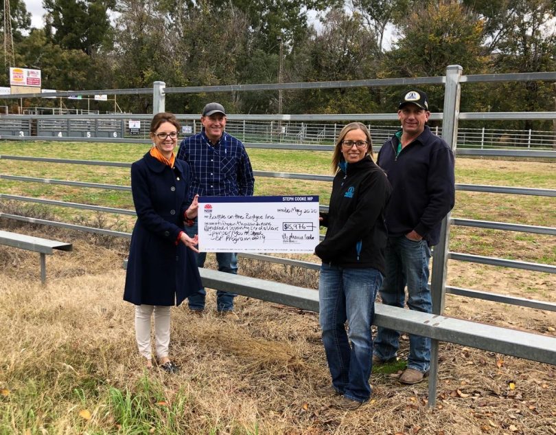 From left: Member for Cootamundra Steph Cooke hands over the funding cheque to Darrell Edwards, Kelly Piper, George Elliot.