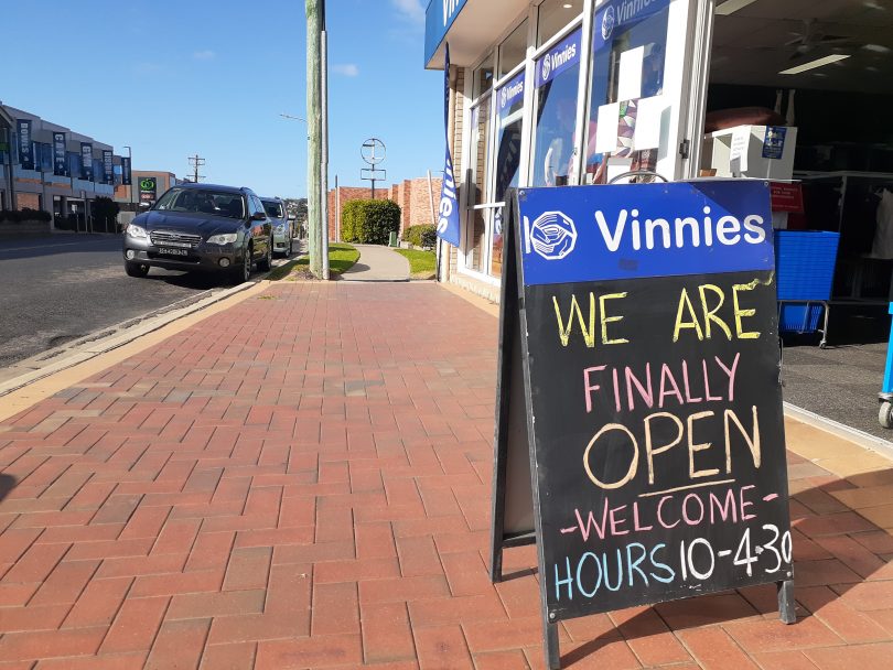 Open-for-business sign outside Vinnies store in Merimbula.