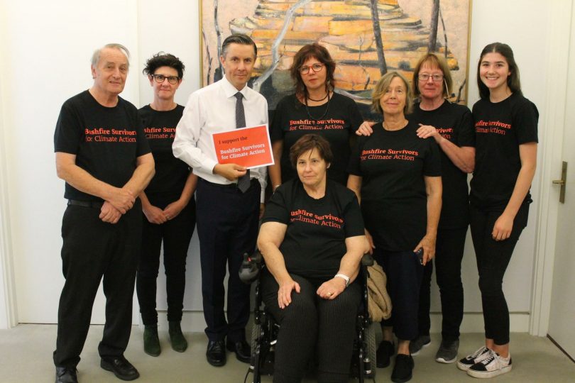 Members of Bushfire Survivors for Climate Action posing with Labor MP Mark Butler.