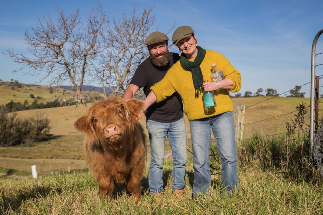 North of Eden distillery owners Gavin Hughes and Karen Touchie with animal on rural property.