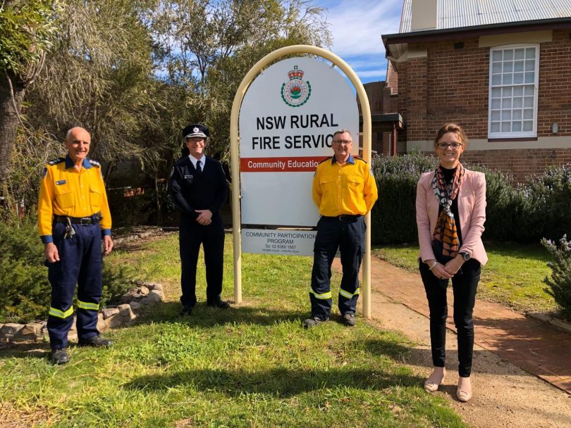 From left: Phillip Baer, Andrew Dillon, Peter Holding, Steph Cooke, standing next to sign outside Rural Fire Service building.