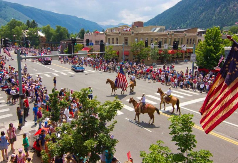 Aerial view of crowd watching horses in parade in Aspen.
