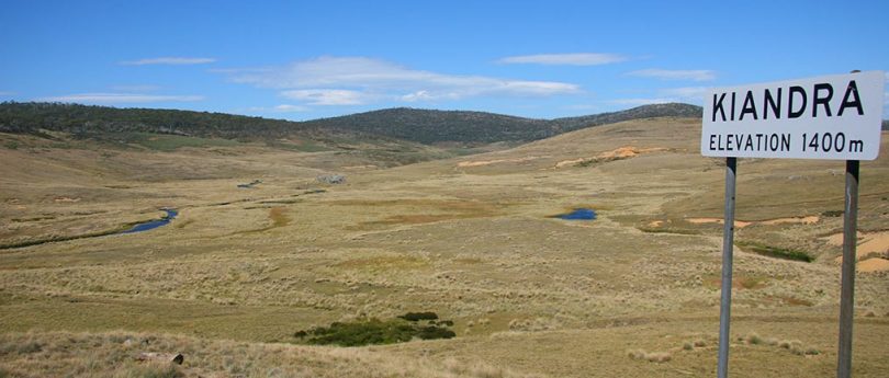 View of Kiandra Plains, with 1400m elevation sign in foreground.