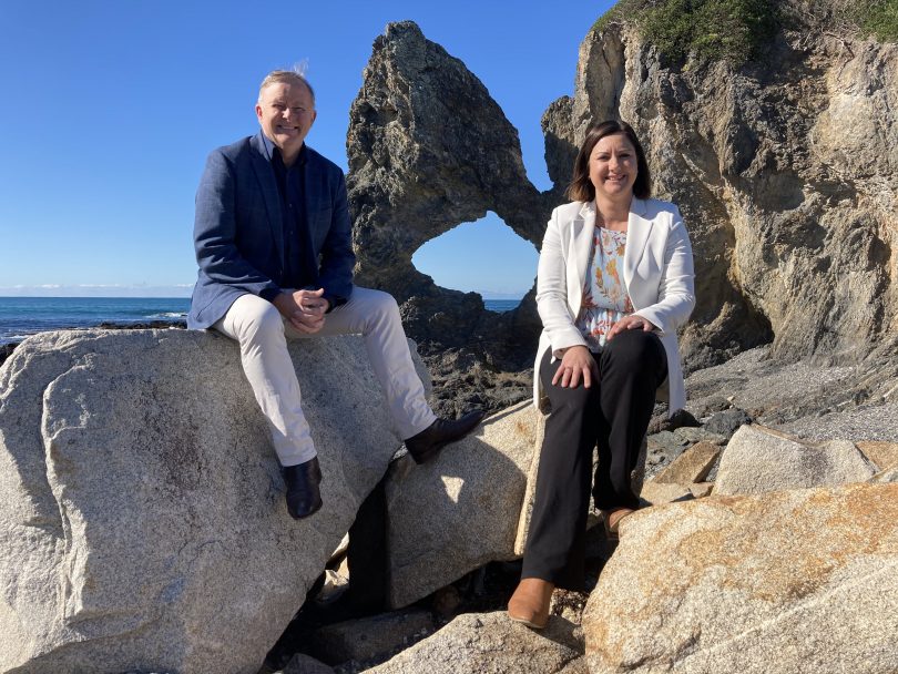 Anthony Albanese and Kristy McBain sitting at Australia Rock in Narooma.