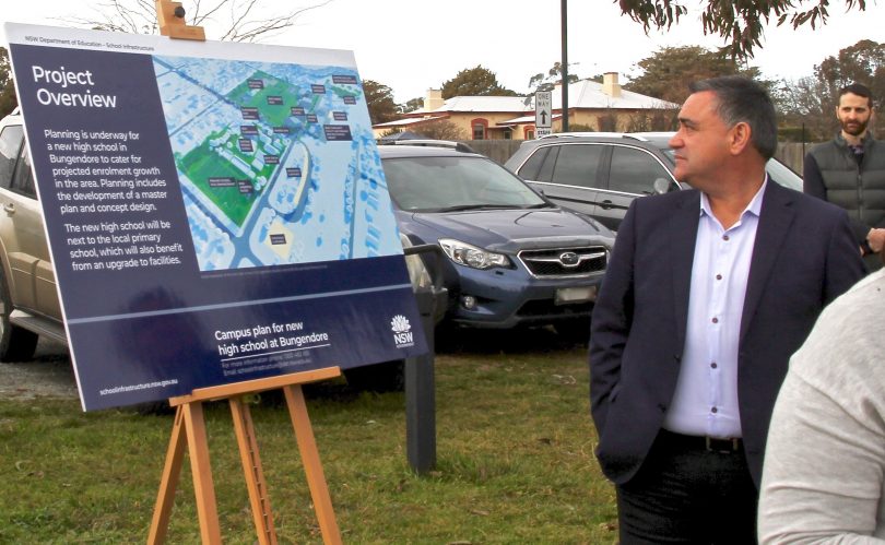 Then-Member for Monaro John Barilaro looking at an information board for the Bungendore High School project