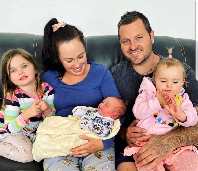 Steph and Tim Dummett with their three children, including newborn baby Inti.
