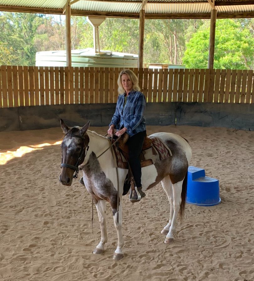 Kim Treasure sitting on Molly the horse.