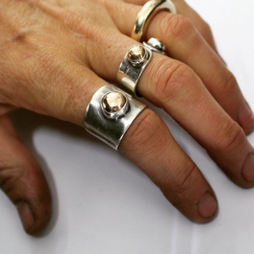 Close-up of fingers wearing repurposed jewellery from RedPeg Eco Studio in Bega.
