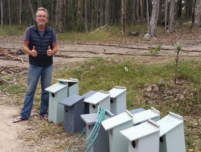James Riccard with nesting boxes on rural property.