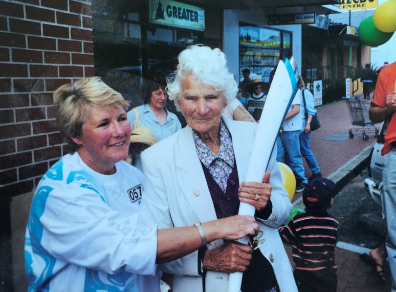 Jan Hogan and Evelyn Miner holding Olympic torch.