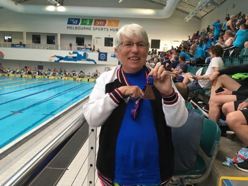Joan Bratton with Masters Swimming bronze medal.