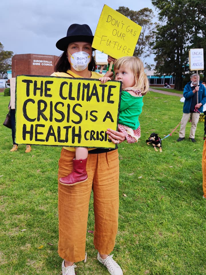 Dr Michelle Hamrosi and daughter at a climate change protest.
