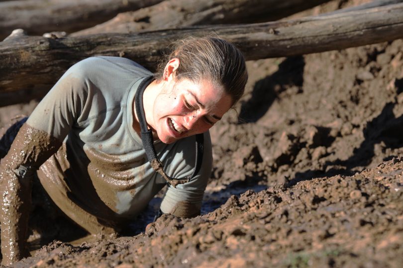 Erin McNaught crawls through mud on SAS Australia.