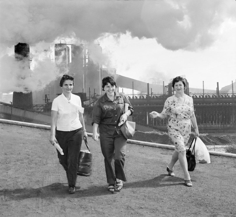 Image from Women of Steel of three women leaving work at Port Kembla steelworks.