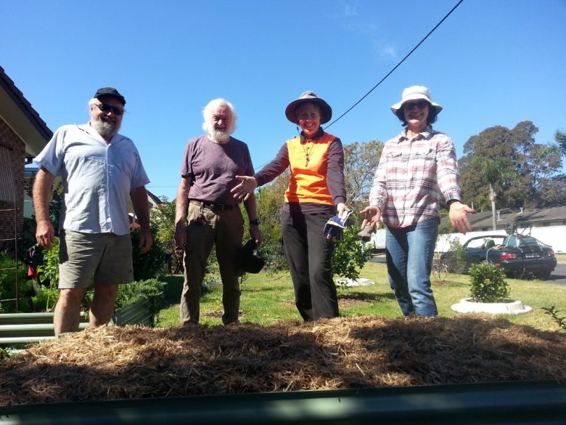 Steve Smith, Terry McGee, Annette Greer and Collette Blacklock show off a new garden bed.