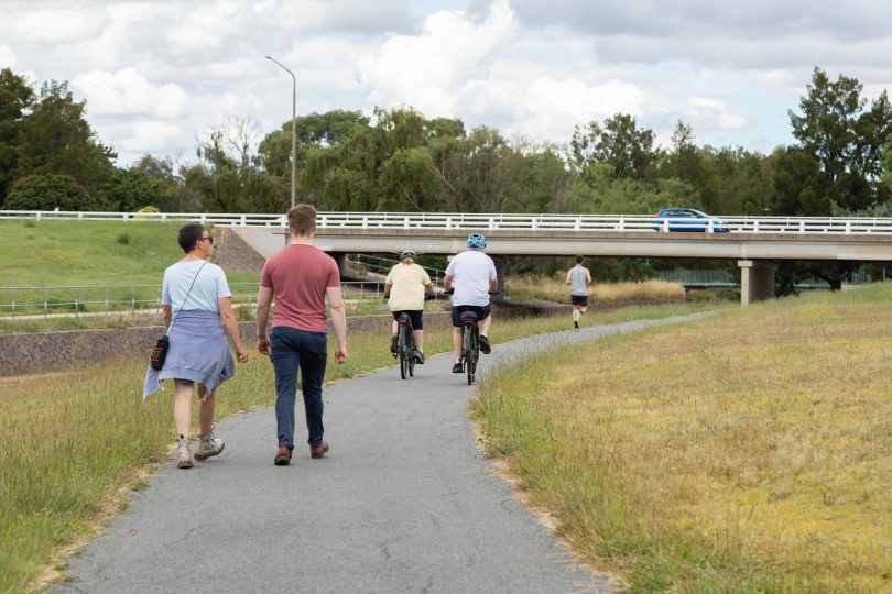 People exercising on bike path