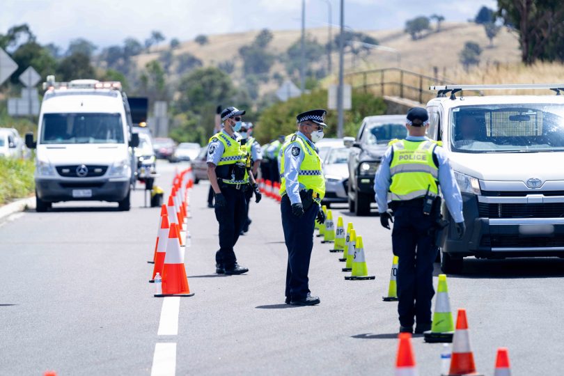 ACT Policing officers checking cars entering the Territory. Photo: Supplied.