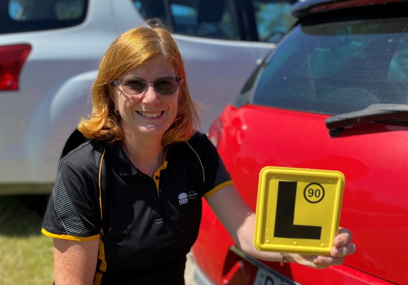 Eurobodalla Shire Council’s road safety officer Kate McDougall holding L-plate.