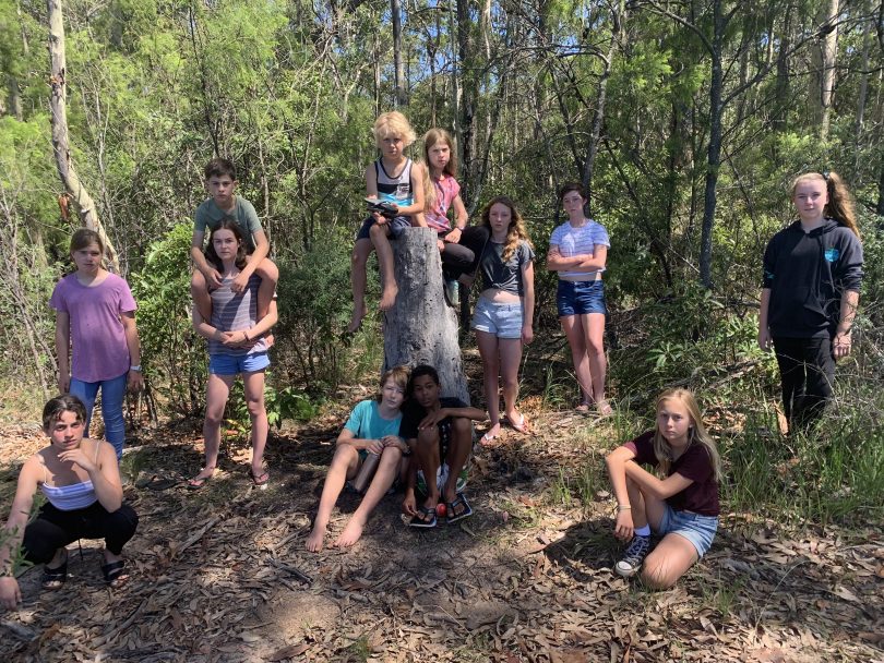 Members of Narooma Youth Theatre standing in bushland.