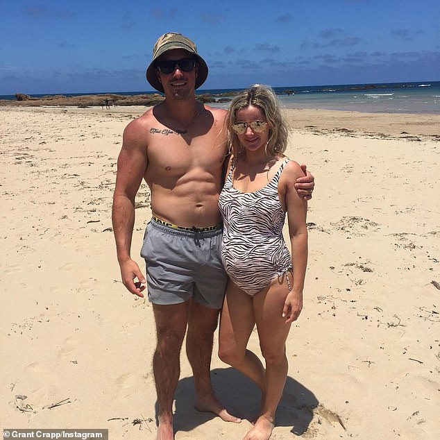 Grant Crapp and pregnant Lucy Cartwright on beach.