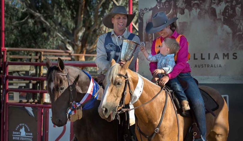 Kieran Davidson and Christy Davidson with their son, Hunter, on horseback with trophy at Man from Snowy River Bush Festival.
