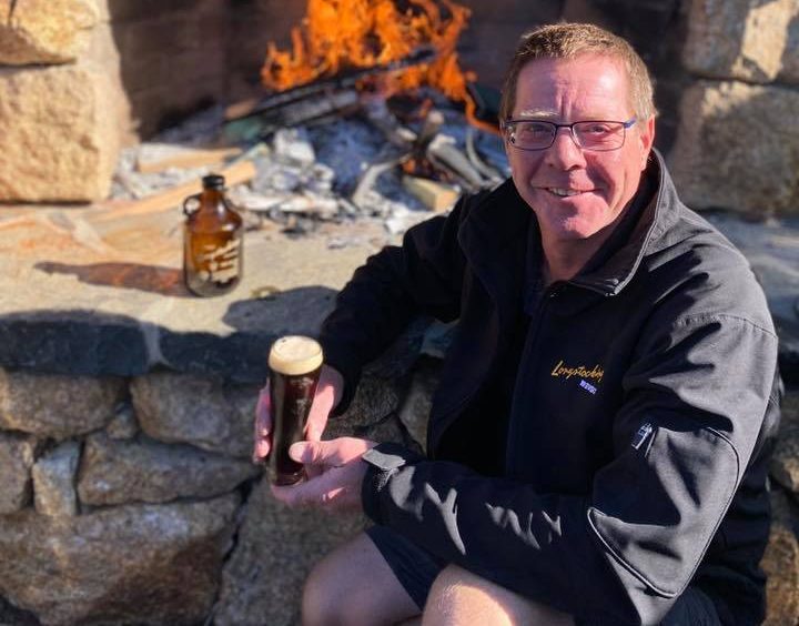 Peter Caldwell from Longstocking Brewery in Pambula holding a beer.